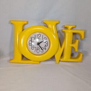 Vintage Love Yellow Plastic Wall Clock 8x16in Hippie Retro Made In USA